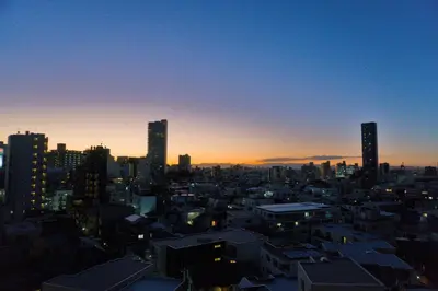 a city skyline at sunset with tall buildings at Yuyake in Tokyo