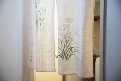 a pair of curtains with flowers on them at Nishi-Ikebukuro 3 in Tokyo