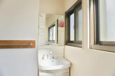 a bathroom with a sink and a mirror at Ikebukuro in Tokyo