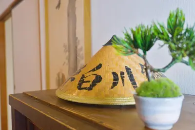 a lamp sitting on a table next to a potted plant at Ikebukuro in Tokyo