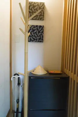 a shelf with a hat on top of a table at Ikebukuro Nigo in Tokyo