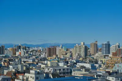 a view of a city with lots of buildings at Nishibi in Tokyo