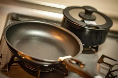 a pan sitting on top of a stove at EAST ONE Higashishinjuku in Tokyo