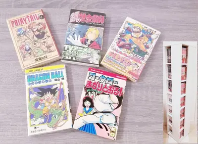a pile of manga books sitting on a table at \u30d4\u30e9\u30cd\u30cf\u30a6\u30b9 in Tokyo