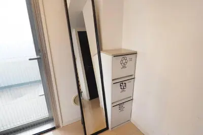 a mirror with three boxes next to a door at \u6e0b\u8c37\u9053\u7384\u5742307 in Tokyo