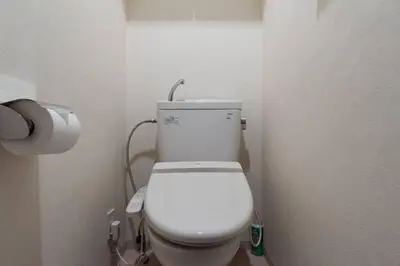 a bathroom with a white toilet in a room at \u6e0b\u8c37\u9053\u7384\u5742401 in Tokyo