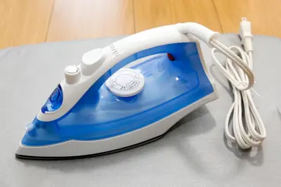 a blue and white iron sitting on top of a table at Tokyo Enjoy Hotel in Tokyo