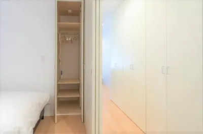 a bedroom with white cabinets and a closet at Salon Shibuya - Vacation STAY 78188 in Tokyo