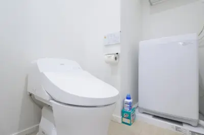 a bathroom with a white toilet in a room at Salon Shibuya - Vacation STAY 78183 in Tokyo