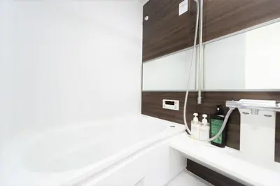 a bathroom with a sink and a mirror at Salon Shibuya - Vacation STAY 78183 in Tokyo