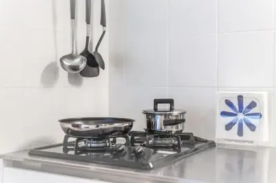 a stove top with two pots and pans on it at Salon Shibuya - Vacation STAY 78186 in Tokyo