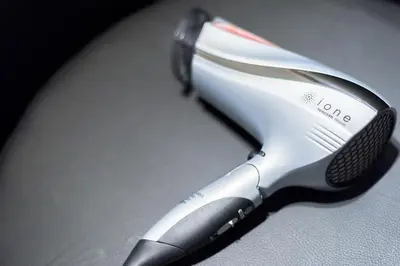 a electric hairdryer sitting on top of a table at Salon Shibuya - Vacation STAY 78186 in Tokyo