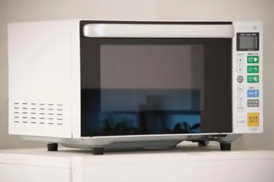 a microwave oven sitting on top of a shelf at Salon Shibuya - Vacation STAY 78187 in Tokyo