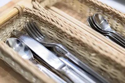 a basket of silverware with forks and spoons at Salon Shibuya - Vacation STAY 78187 in Tokyo