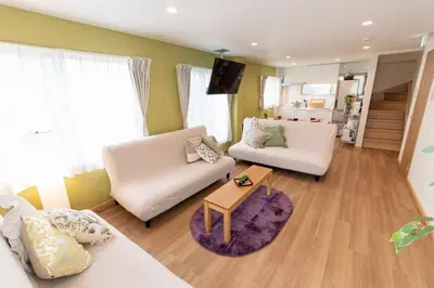 a living room with two white couches and a table at TK Court Ojima - Vacation STAY 91237 in Tokyo