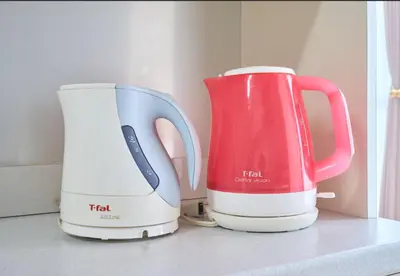 two white and red appliances sitting on a counter at ColorBee Shinjuku Yotsuya Big House in Tokyo