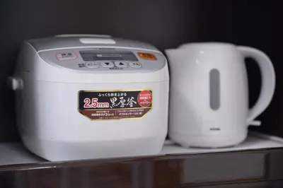a toaster and a coffee maker sitting on a counter at Green House 101 in Tokyo