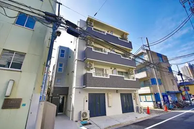 a building on the side of a city street at Prime Stage Otsuka 204 - Vacation STAY 8875 in Tokyo