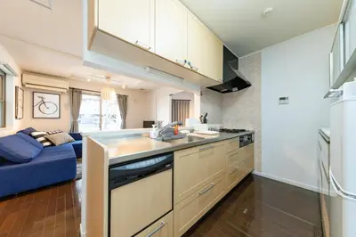 a kitchen with a sink and a couch in a room at Katsushika-ku - House - Vacation STAY 89073 in Tokyo