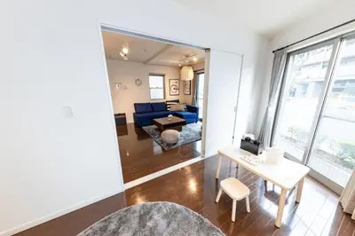 a living room with a blue couch and a table at Katsushika-ku - House - Vacation STAY 89073 in Tokyo