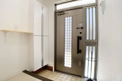 a door in a room with a tile floor at Sunstay - Shinbamba 1 in Tokyo