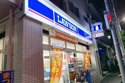 a store with signs on the side of a building at Sun Stay \u5927\u5d0e1 in Tokyo