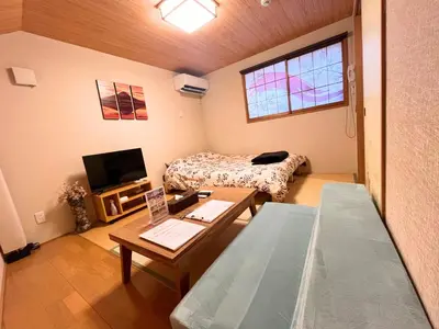a small room with a bed and a table at Hotel EL Shinjuku 6 in Tokyo