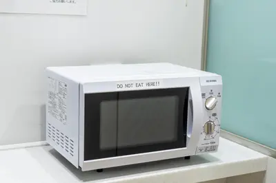 a white microwave oven sitting on a counter at KOKO HOTEL Ginza-1chome in Tokyo