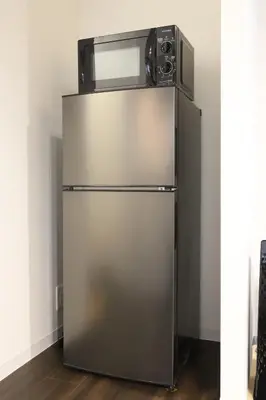 a refrigerator with a microwave on top of it at Katsushika-ku - House - Vacation STAY 92154 in Tokyo