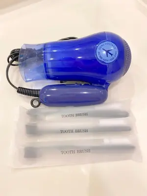 a blue phone sitting on top of four white tissues at Pangoo Shinagawa in Tokyo