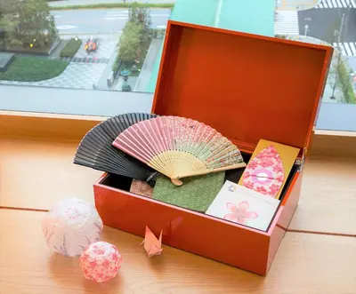 a wooden box with an umbrella and other items at The Okura Heritage Tokyo in Tokyo