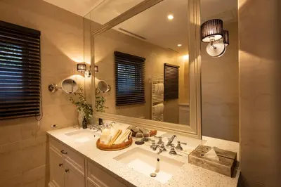 a bathroom with a sink and a large mirror at PETALS TOKYO - Floating Hotel in Tokyo