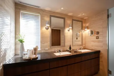 a bathroom with a sink and a mirror at PETALS TOKYO - Floating Hotel in Tokyo