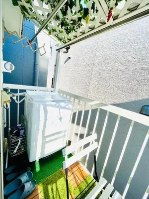 a balcony with a white fence and a white bench at YUYUSO Hostel-SG0165 in Tokyo