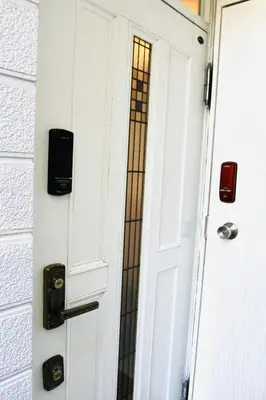a door with a stained glass window behind it at YUYUSO Hostel-SG0165 in Tokyo