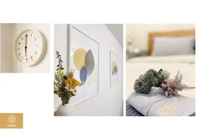 two pictures of a bedroom with a clock and flowers at nestay apartment tokyo nippori in Tokyo