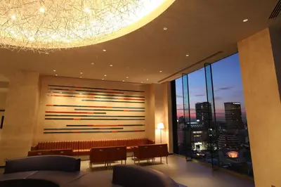 a room with a large window with a view of a city at The Gate Hotel Kaminarimon by Hulic in Tokyo