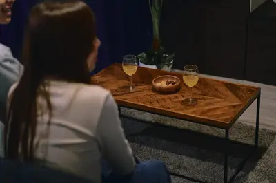 a woman sitting at a table with two glasses of wine at Sukumo -\u8485- in Tokyo