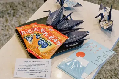 a table with a bag of chips and a bag of snacks at Sukumo -\u8485- in Tokyo