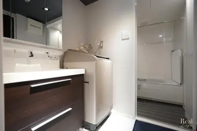 a small kitchen with a sink and a refrigerator at Real Life AOYAMA in Tokyo