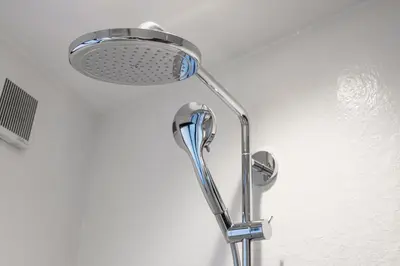 a shower head on a wall in a bathroom at NEXUS HOTEL Ebisu in Tokyo