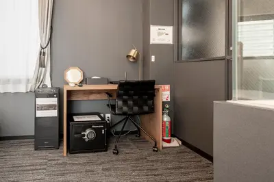 an office with a desk with a chair and a computer at NEXUS HOTEL Ebisu in Tokyo