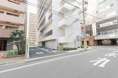 an empty street in a city with buildings at Super Hotel Tokyo Akabane Eki Minamiguchi in Tokyo