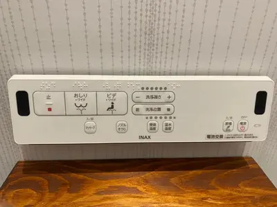 a close up of a control panel of a appliance at Holy House in Tokyo