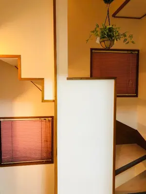 a room with a staircase and two windows at Green House 201 in Tokyo