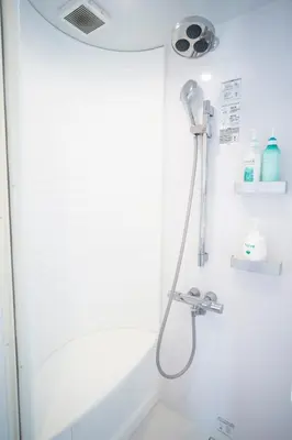 a shower with a shower head in a bathroom at TOGOSHI 568 STAY Togoshi Ginza in Tokyo