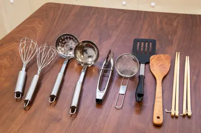 a bunch of utensils sitting on a wooden table at TOGOSHI 568 STAY Togoshi Ginza in Tokyo