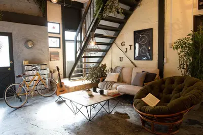 a living room with a couch and a table at Exclusive Accommodation 9bicycle 9ppl in Tokyo