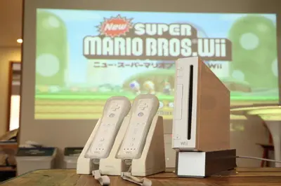 two nintendo wii game controllers sitting on top of a table at Exclusive Accommodation 9bicycle 9ppl in Tokyo