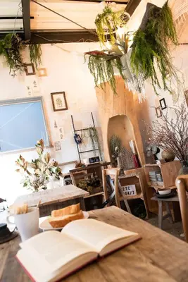 an open book sitting on top of a wooden table at Exclusive Accommodation 9bicycle 9ppl in Tokyo